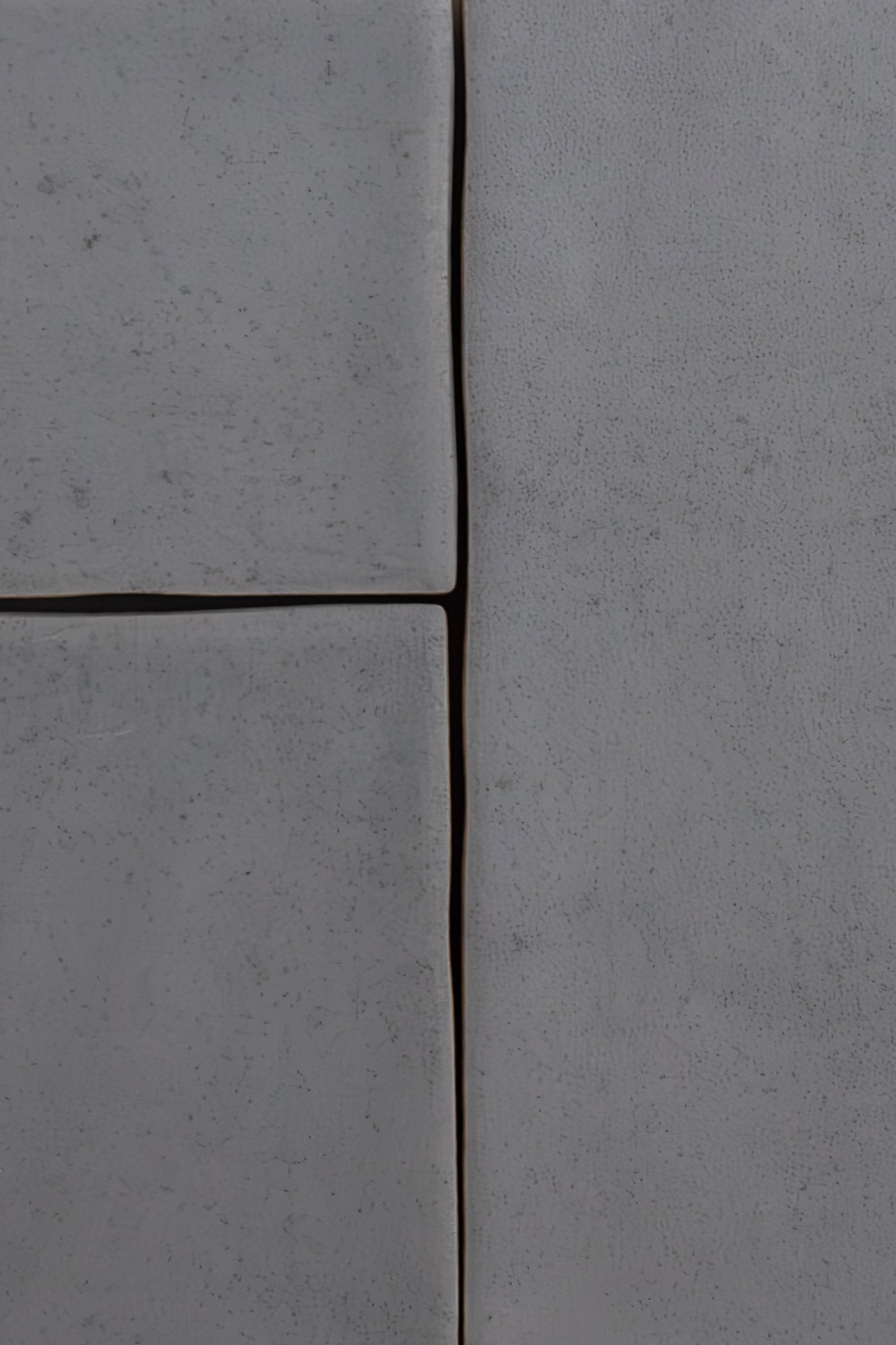 Four large Bourton Dark Blue tiles by Cottage Ivy with slightly uneven edges and narrow dark gaps between them.