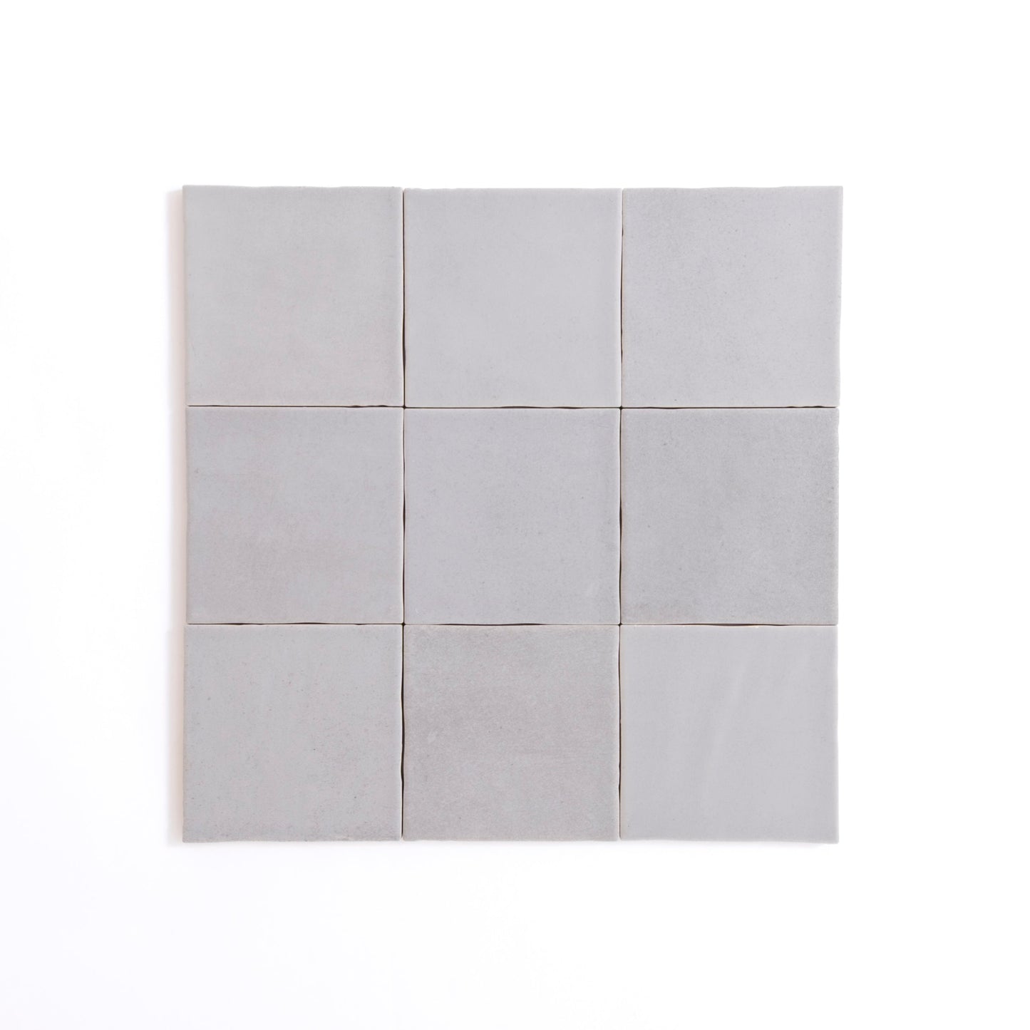 A single glossy Bourton Dark Blue tile by New York Cement Tile centered on a plain white background.