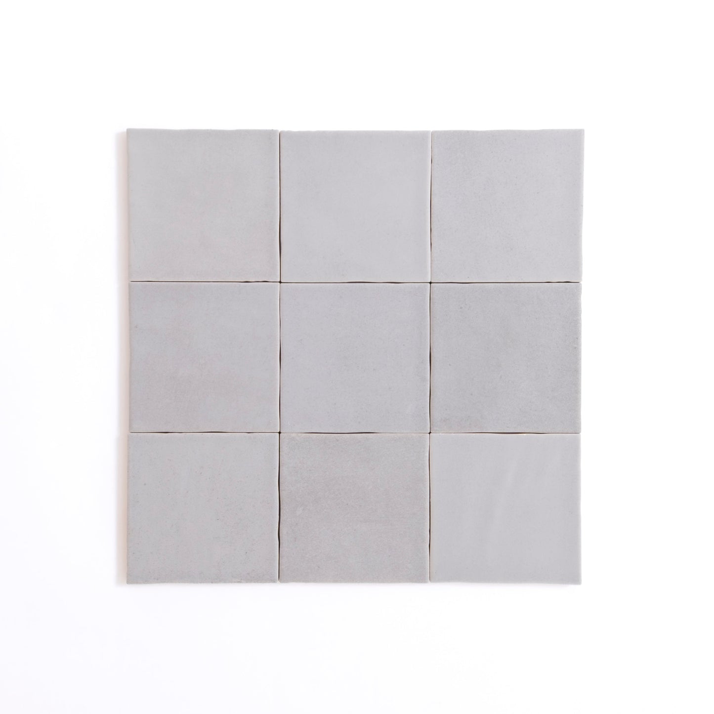 Nine Bourton Dark Blue square tiles by Cottage Ivy arranged in a 3x3 grid on a white background.