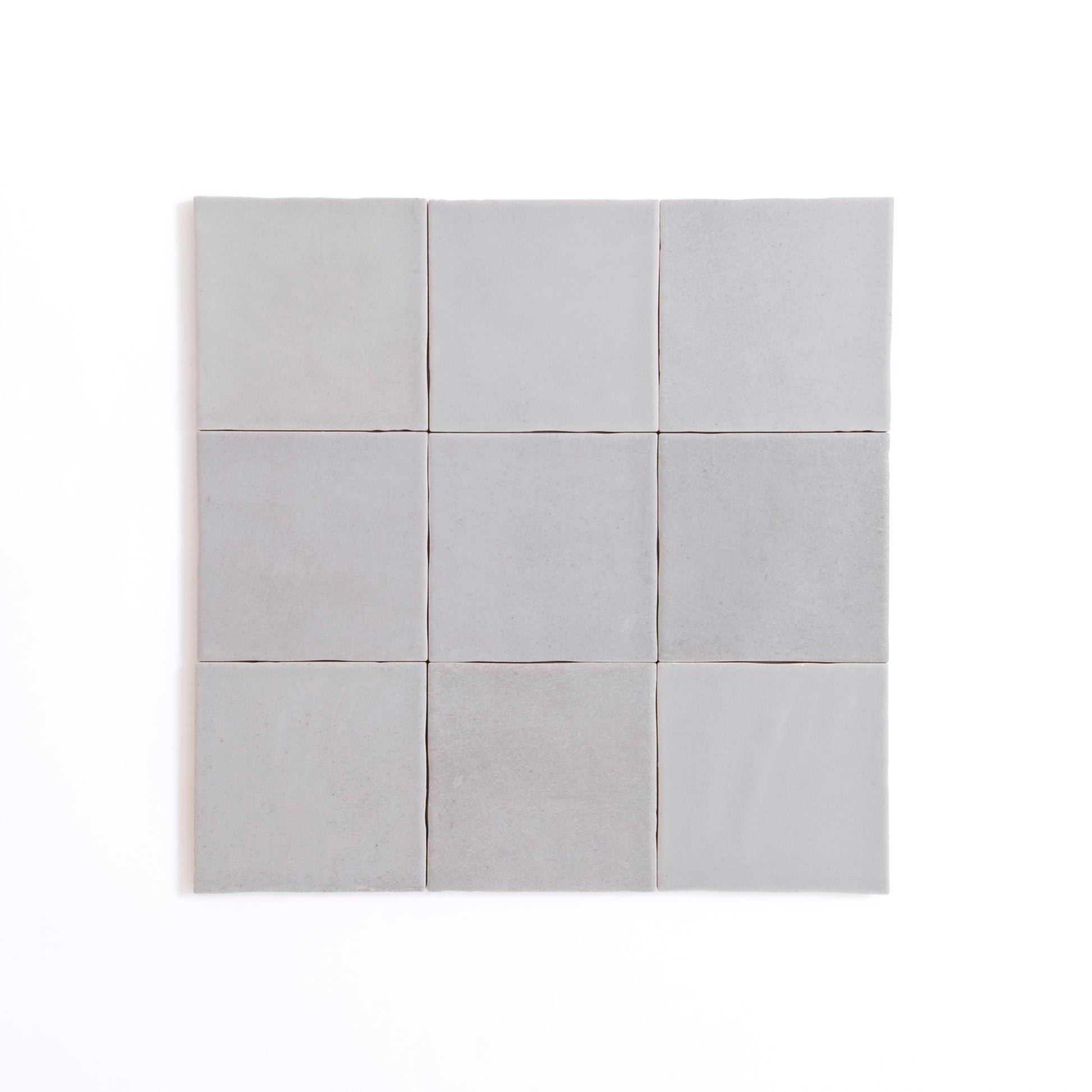 Nine Bourton Dark Blue square tiles by Cottage Ivy arranged in a 3x3 grid on a white background.