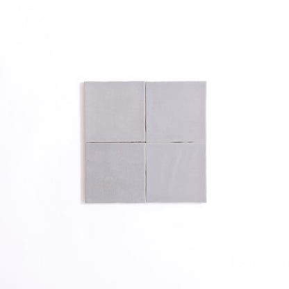 Four Bourton Dark Blue square tiles by Cottage Ivy arranged 2x2 on a white background.