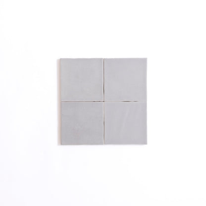 Four Bourton Dark Blue tiles by Cottage Ivy arranged 2x2 on a plain white background.