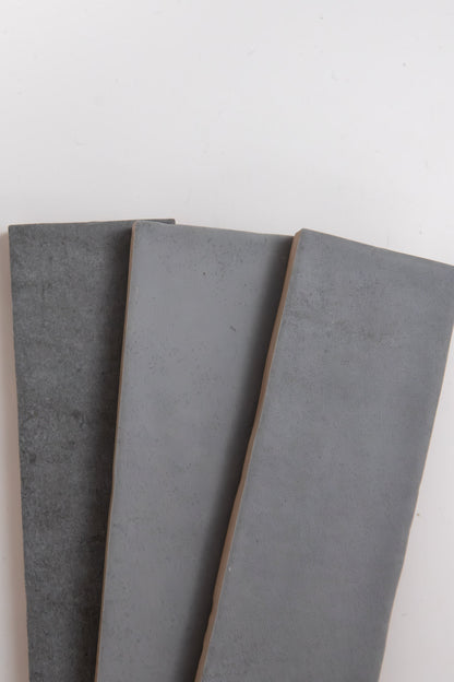 Three Bourton Dark Blue tiles by Cottage Ivy are arranged side by side on a white background.