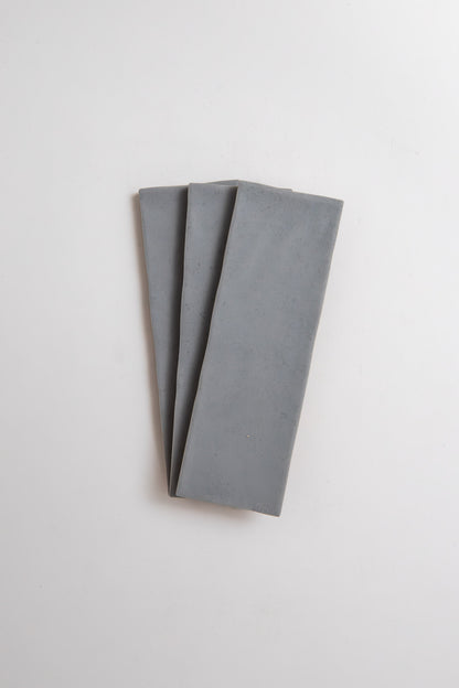 Three Bourton Dark Blue Extra Sample slabs by Cottage Ivy, arranged fan-shaped on a white background.