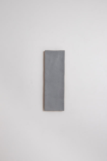 A single Bourton Dark Blue tile by Cottage Ivy is centered on a plain white background.