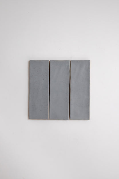 Three Bourton Dark Blue tiles by Cottage Ivy are aligned vertically side by side against a plain white background.