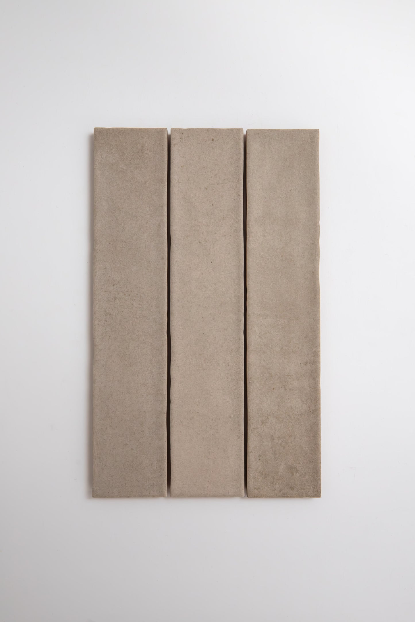 Three Buckland Beige tile samples by Cottage Ivy arranged vertically on a plain white background.