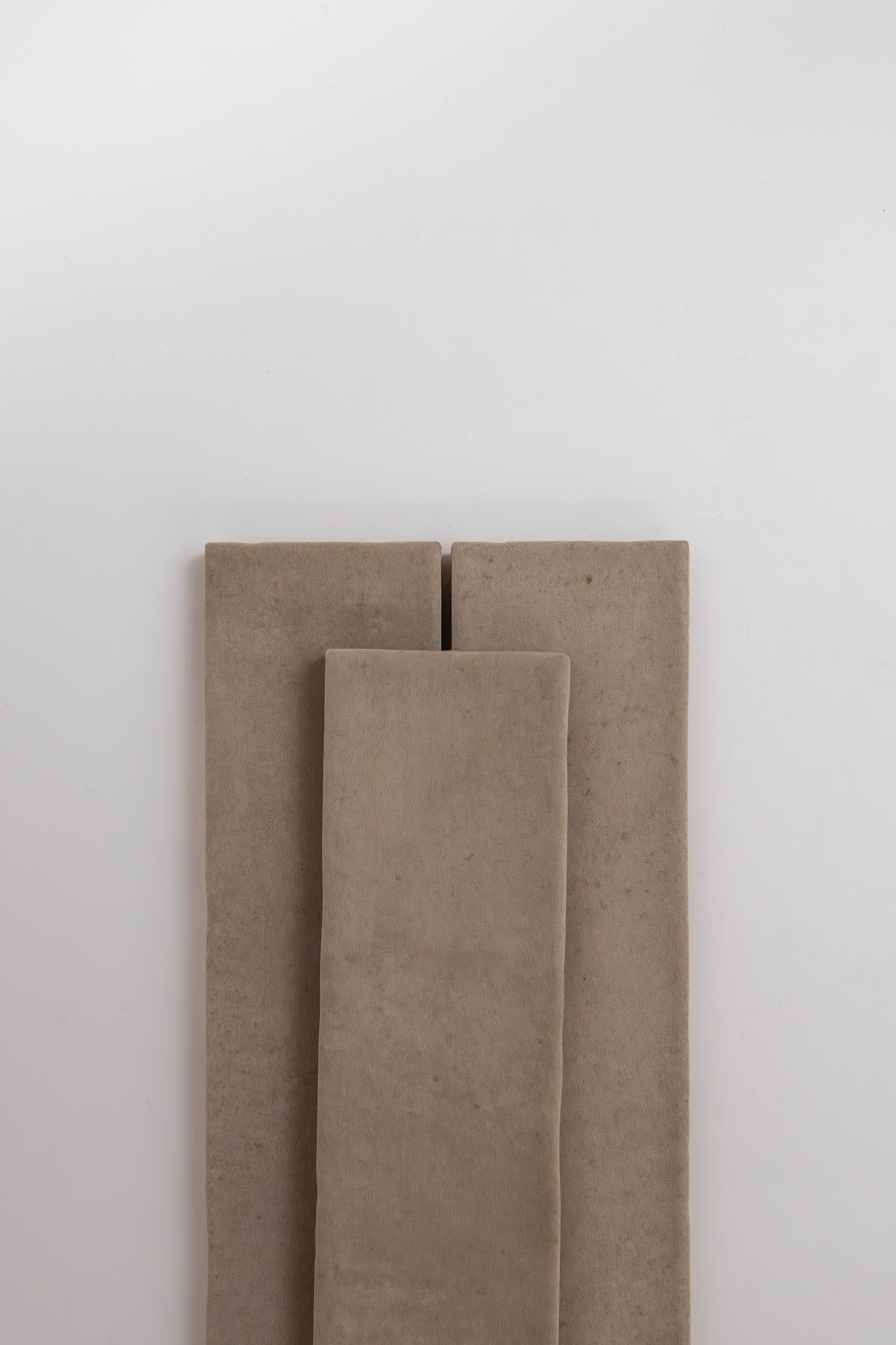 Three Buckland Beige cushions by Cottage Ivy are vertically arranged against a plain white background.