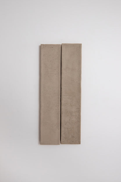 Two Buckland Beige tile samples by Cottage Ivy are placed side by side on a plain white background.