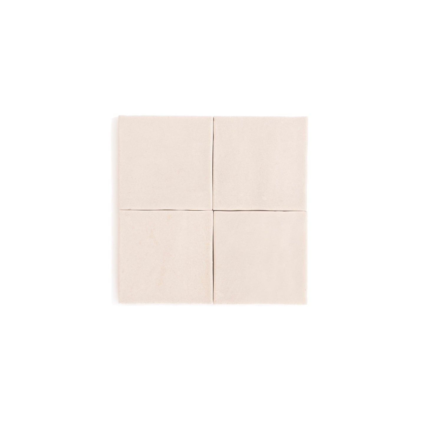 Four Buckland Beige ceramic tiles by Cottage Ivy arranged in a 2x2 grid on a white background.