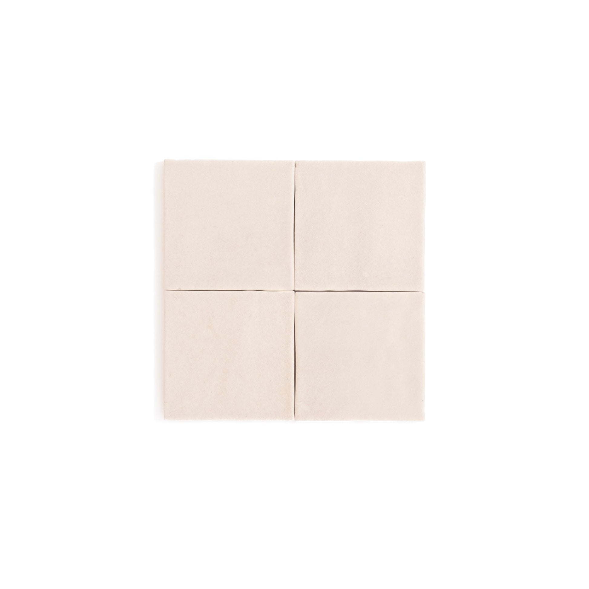 Four Buckland Beige ceramic tiles by Cottage Ivy arranged in a 2x2 grid on a white background.