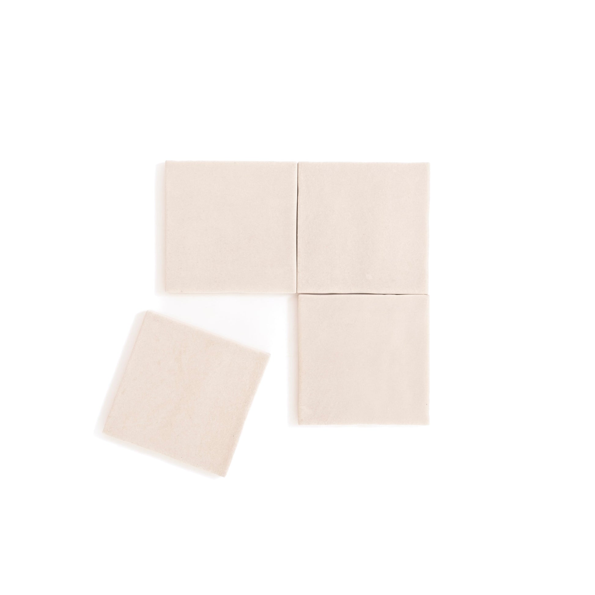 Four Buckland Beige tiles by Cottage Ivy are shown in a grid, with one tile angled and slightly separated to the left.