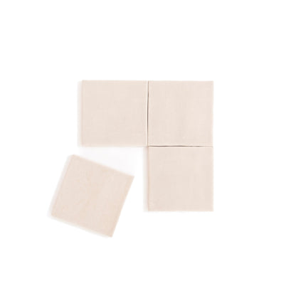 Four Buckland Beige tiles by Cottage Ivy are shown in a grid, with one tile angled and slightly separated to the left.