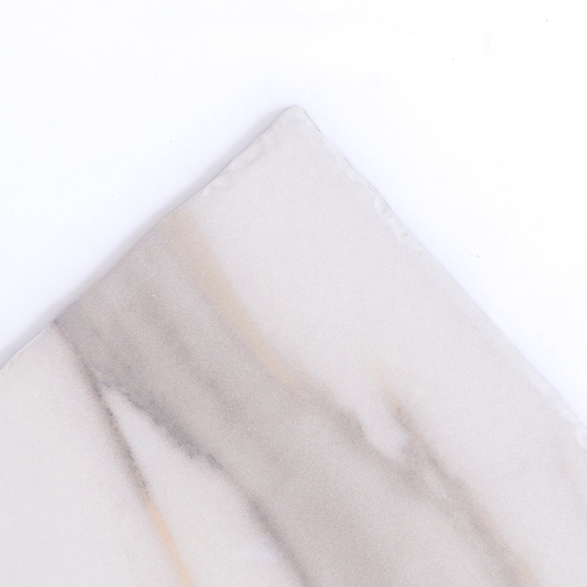 Calacatta Gold by New York Cement Tile: a square white tile with a diagonal gray and beige streak on top half.