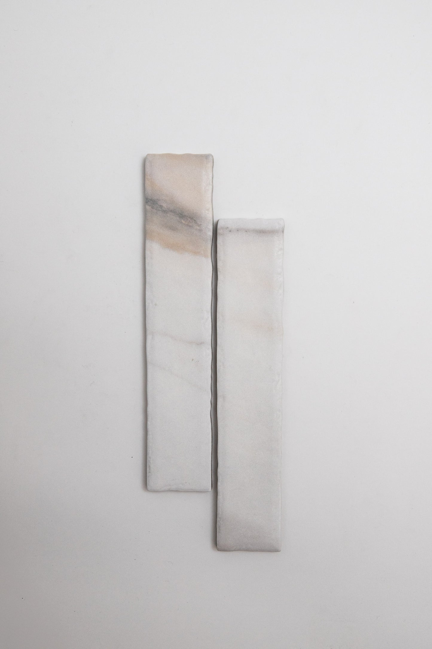 Two Calacatta Gold, Extra Sample marble pieces by Tosca with subtle veins set vertically on a plain white background.