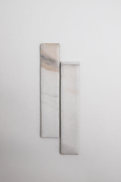 Two Calacatta Gold, Extra Sample marble pieces by Tosca with subtle veins set vertically on a plain white background.