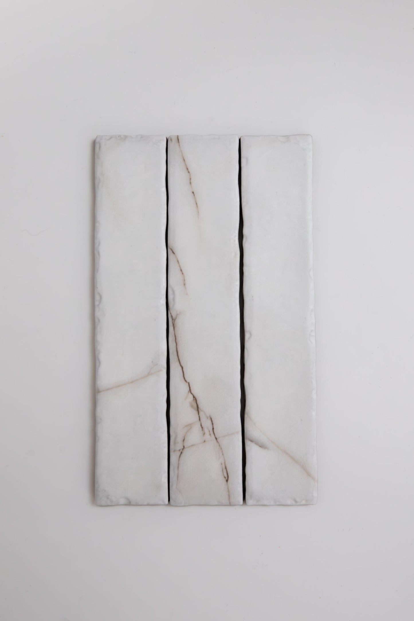 Three Calacatta Soft marble tile samples by Tosca, arranged vertically against a plain white background.