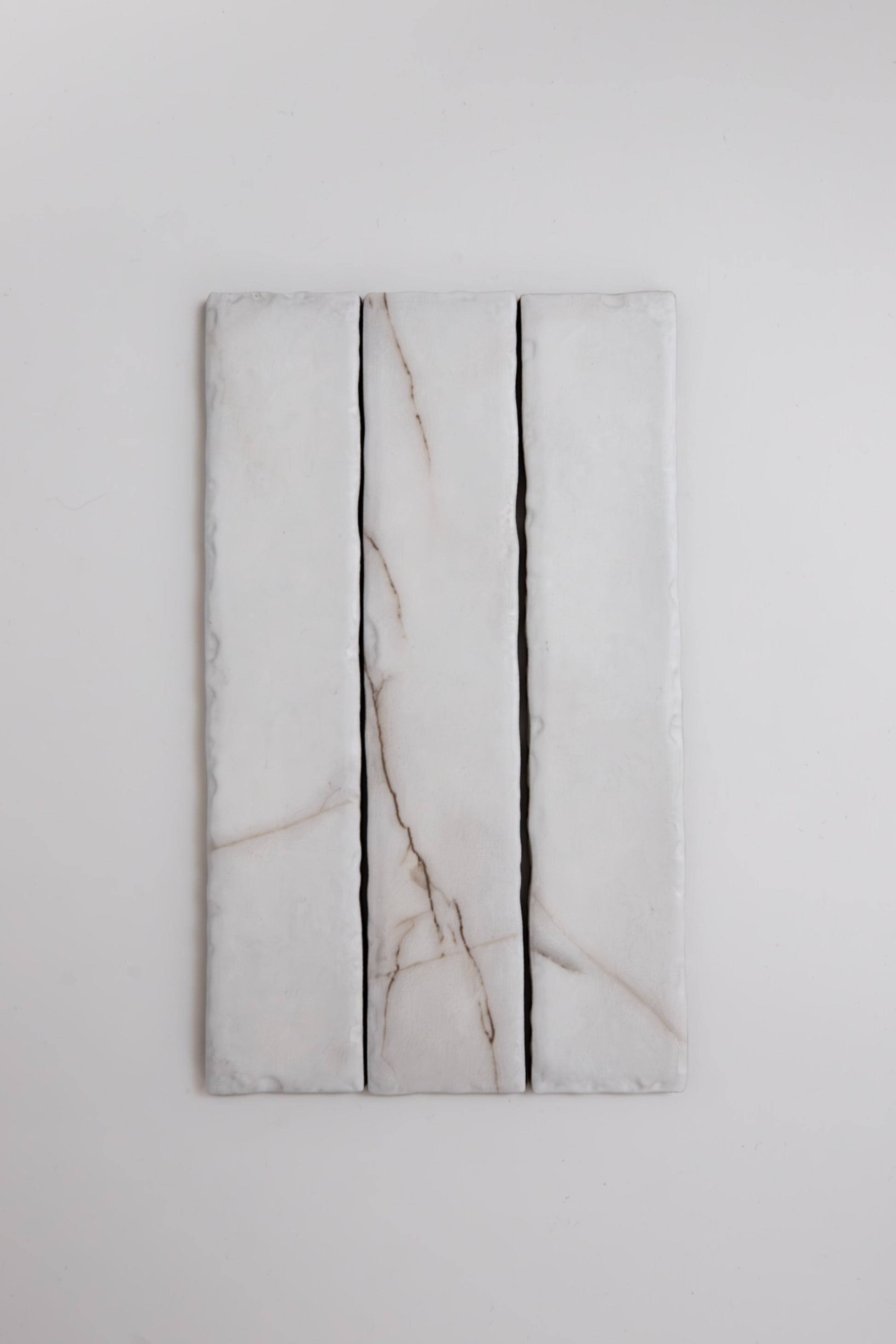 Three Calacatta Soft marble tile samples by Tosca, arranged vertically against a plain white background.