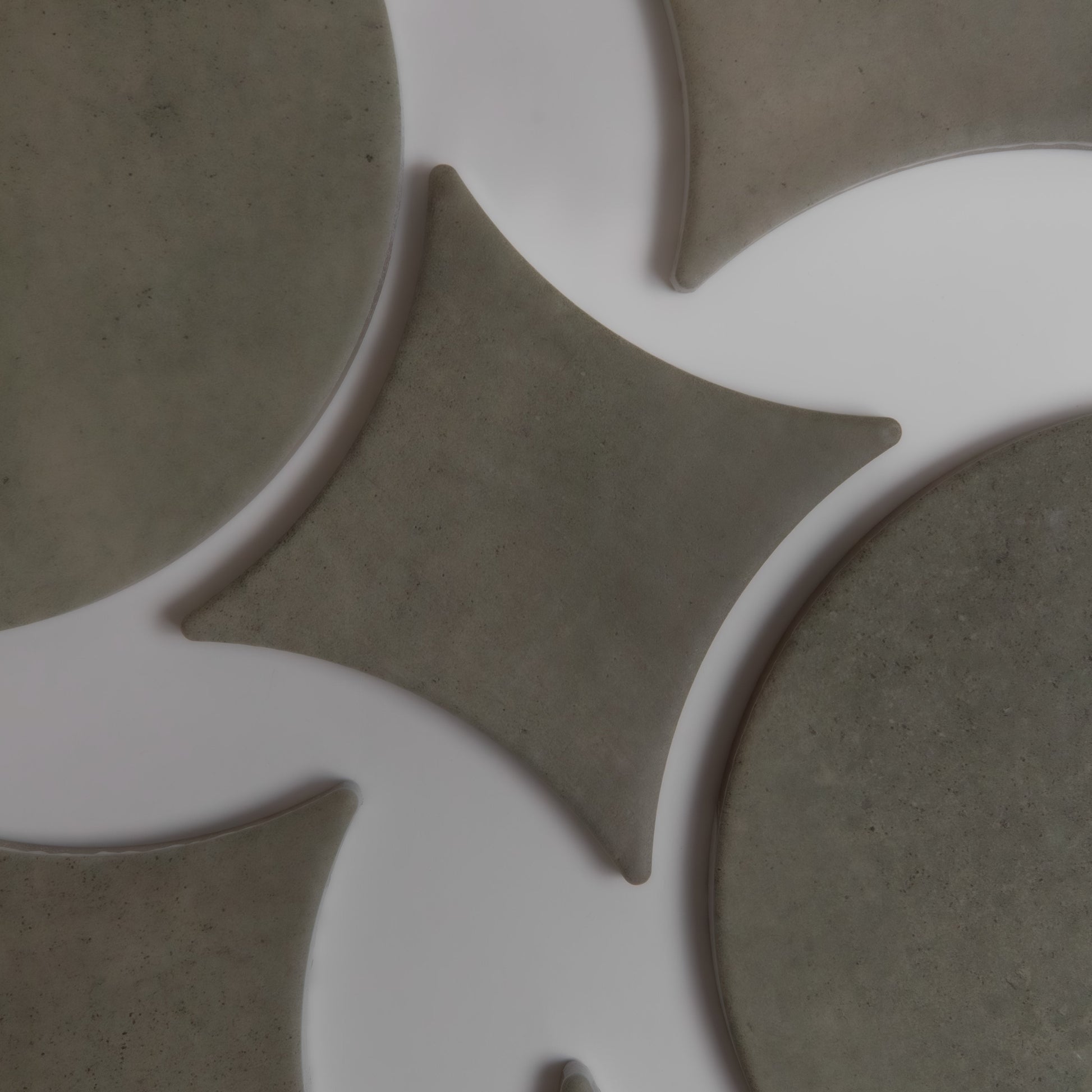Cardon, Extra Sample by Finca features abstract gray rounded shapes and diamonds on a white background.