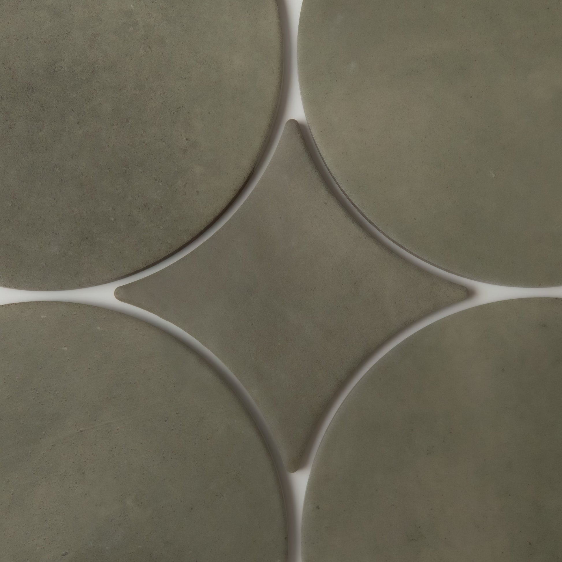 Close-up of Cardon, Extra Sample tiles by Finca: greenish-gray circles with white grout forming diamond shapes.