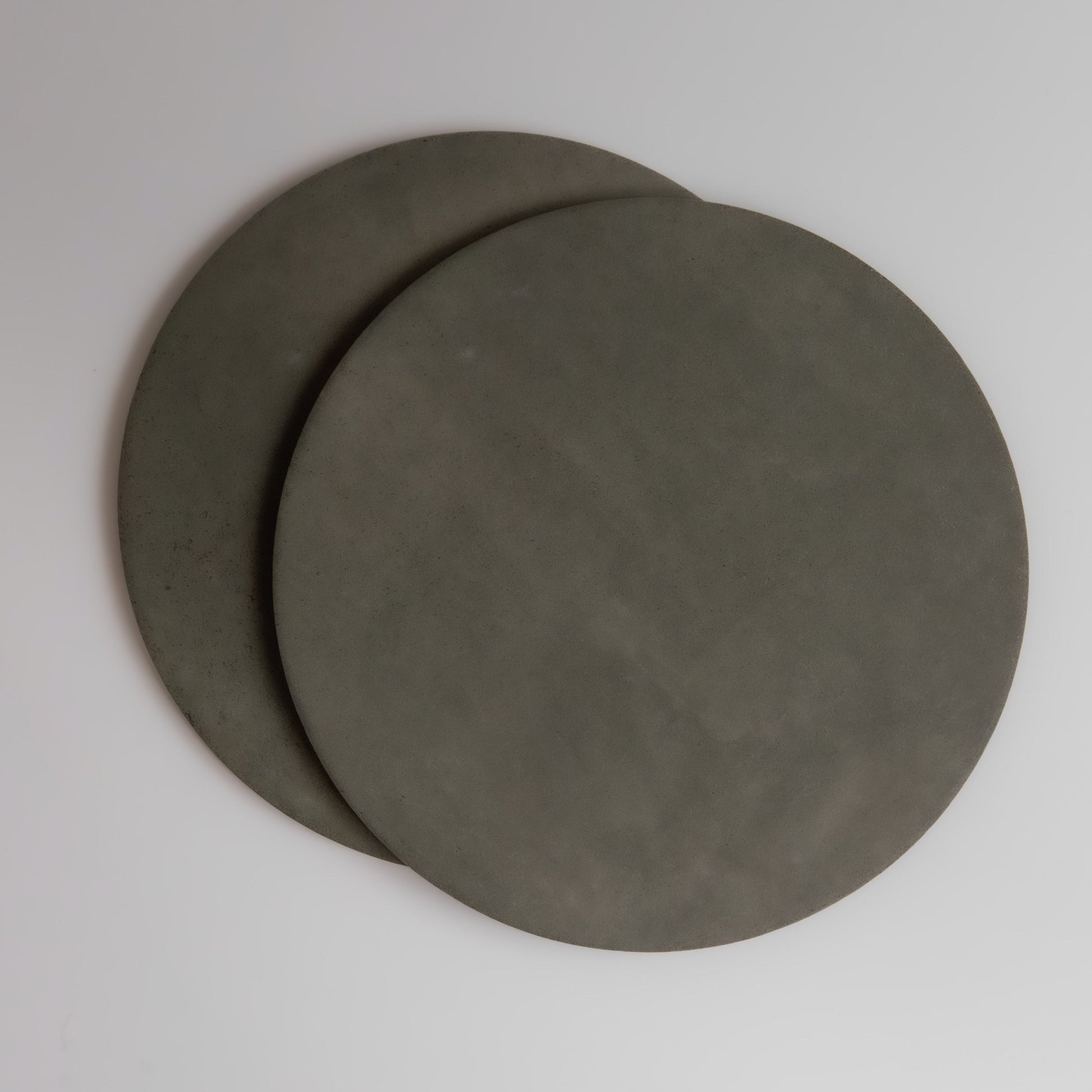 Two overlapping round gray Finca Cardon Extra Sample discs on a plain white background.