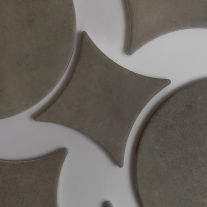 Finca's Cardon sample features gray geometric tiles with circles and diamonds on a white background.