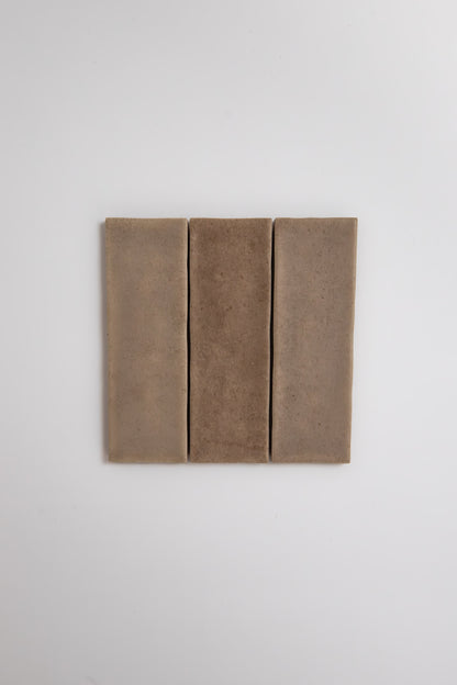 Three Castlegate Brown tiles by Cottage Ivy are arranged vertically side by side on a plain white background.
