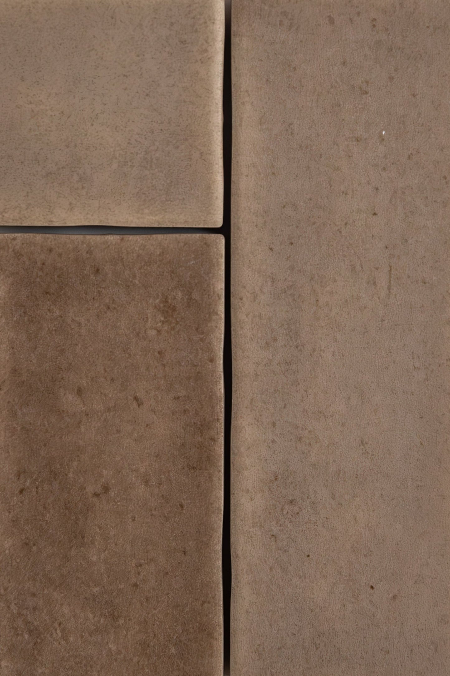 Close-up of Castlegate Brown tiles by Cottage Ivy, showing textured surface, visible seams, and subtle variations.
