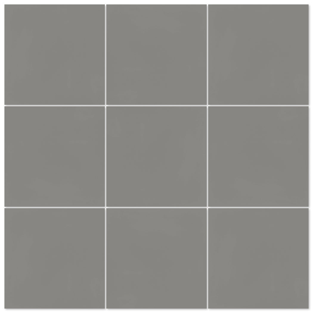 A grid of nine gray 2202-Solid 4x4 tiles by New York Cement Tile, separated by white lines, forms durable flooring.