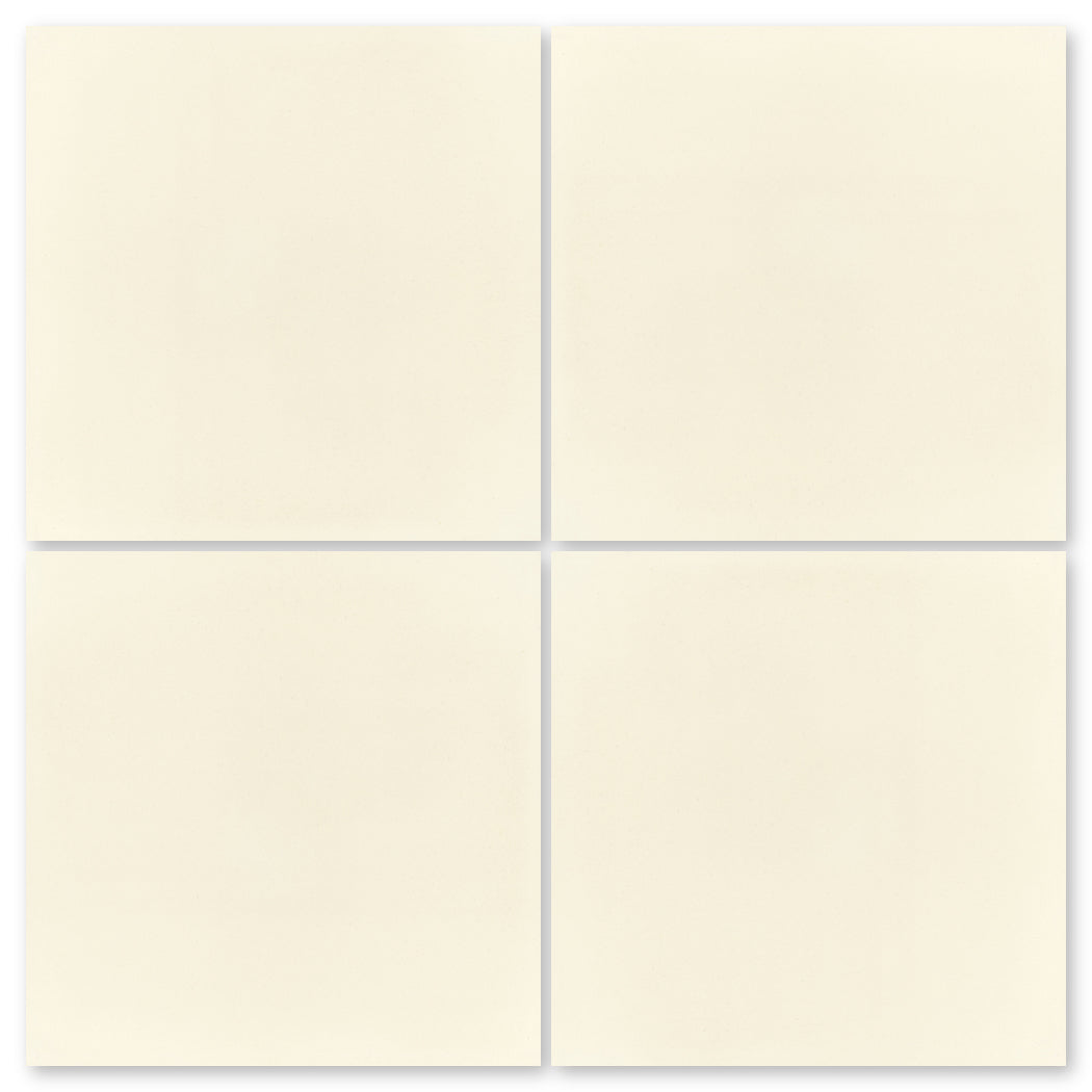 Four cream-colored 1110-Solid tiles by New York Cement Tile, arranged in a 2x2 grid with narrow gaps between them.