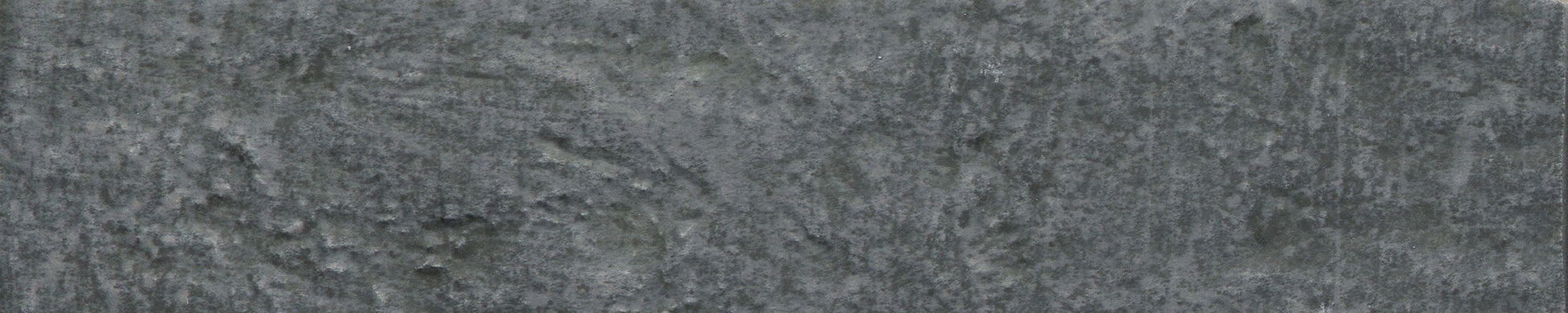 Charcoal - Brique by New York Cement Tile: textured gray stone look with natural patterns, ideal for statement walls.