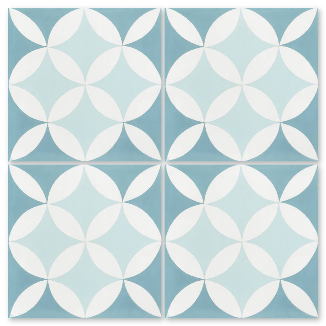The N20-062 4400/2 tile by New York Cement Tile features overlapping white petals on light blue and teal in a circular motif.