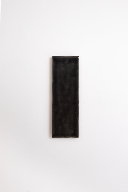 A Cobbled Graphite tile by Cottage Ivy is centered on a plain white background.