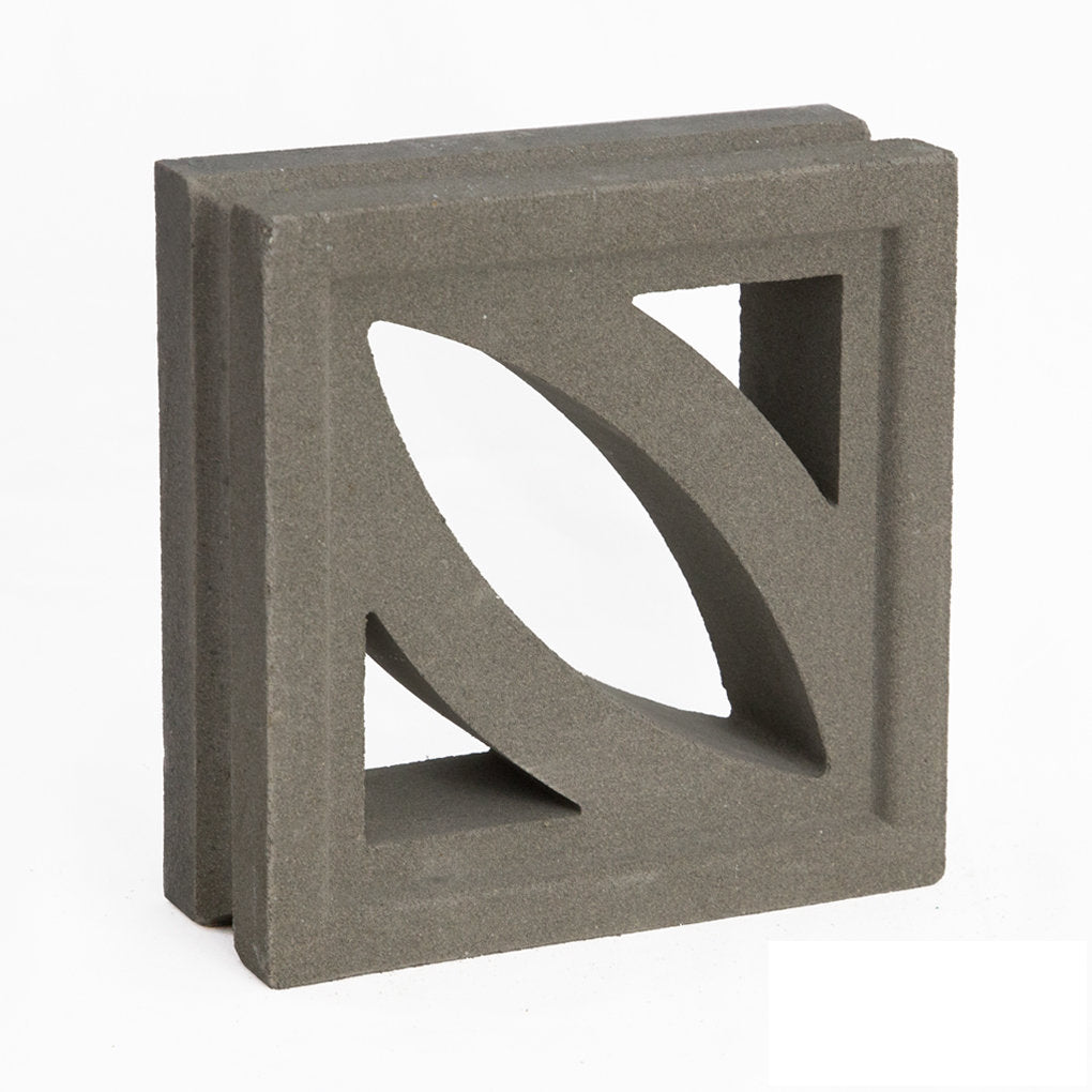 The Coz by New York Cement Tile is a gray concrete block with a leaf cutout, ideal for mid-century modern partitions.