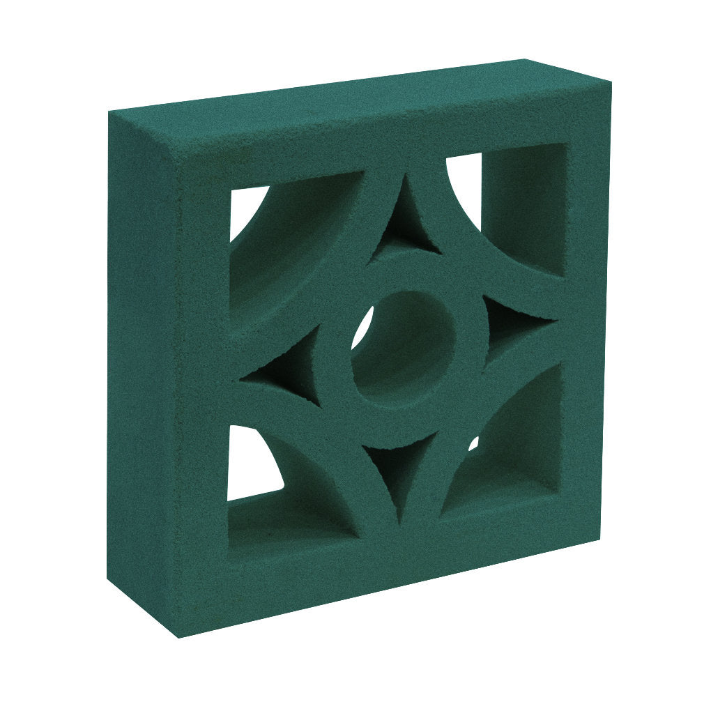 The Cura Sample by New York Cement Tile is a green breeze block with geometric diamond and circle cut-outs for stylish privacy.