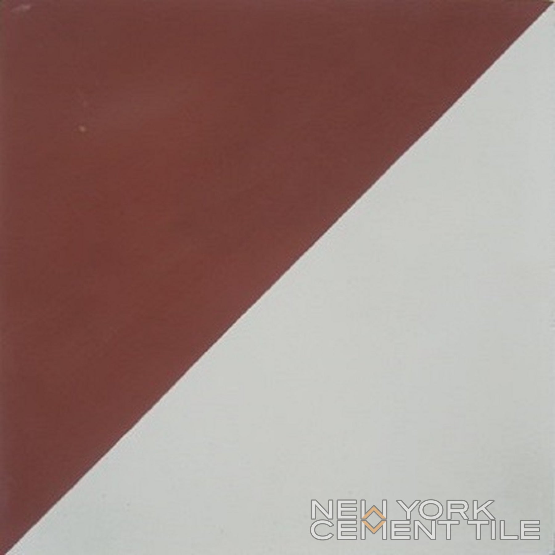 A square tile divided diagonally into brown and white halves. N20-139, Extra Sample by New York Cement Tile.