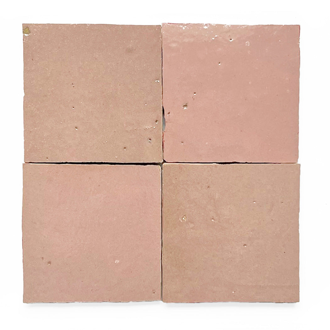Four pinkish-brown square tiles arranged in a 2x2 grid on a white background.