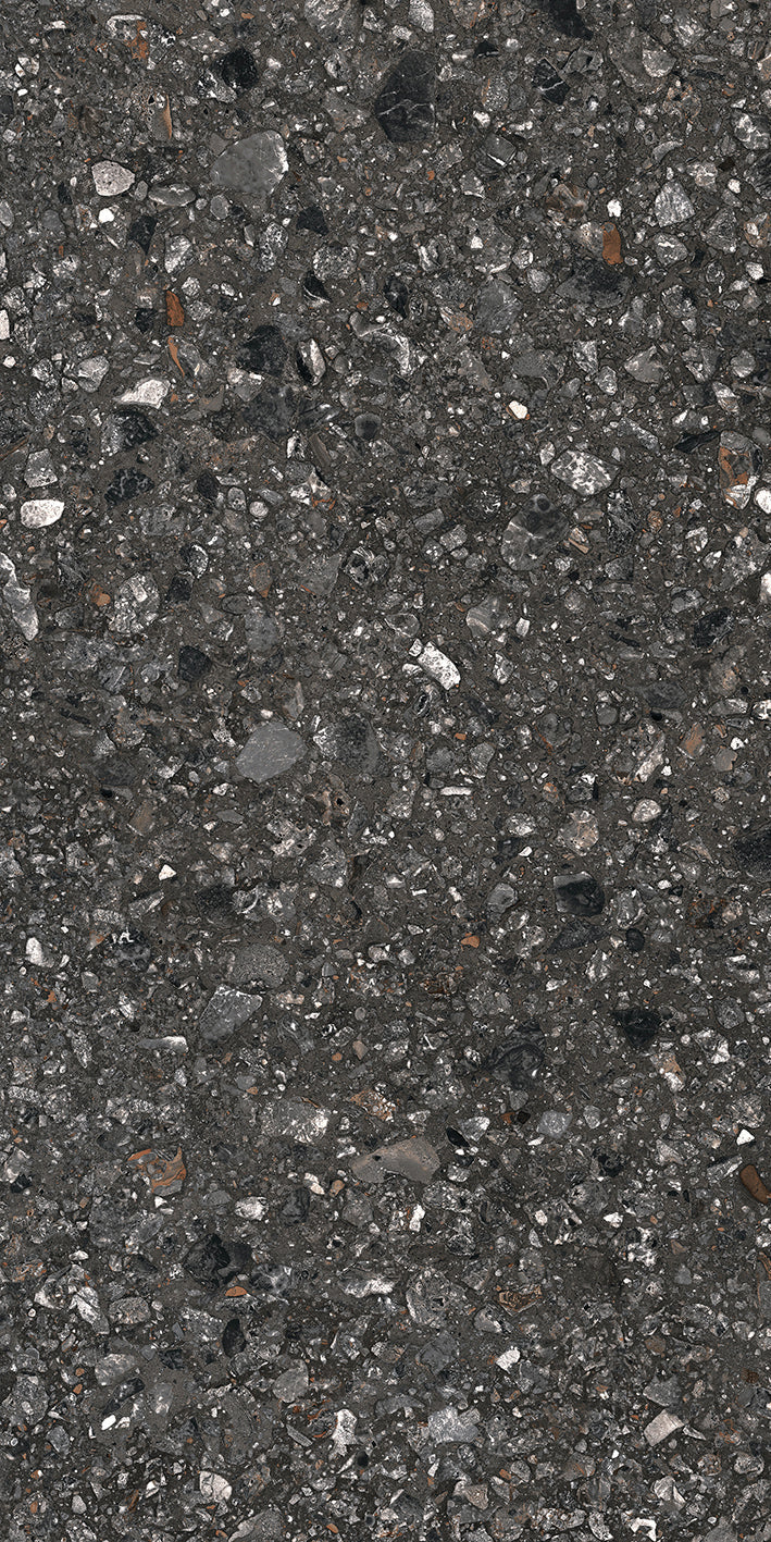 Close-up of Dye - Perenne - Sample by New York Cement Tile: dark asphalt look with stone and terrazzo textures.