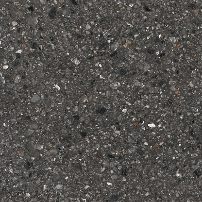 Close-up of Dye - Perenne - Sample by New York Cement Tile, featuring a dark, textured modern paving surface.