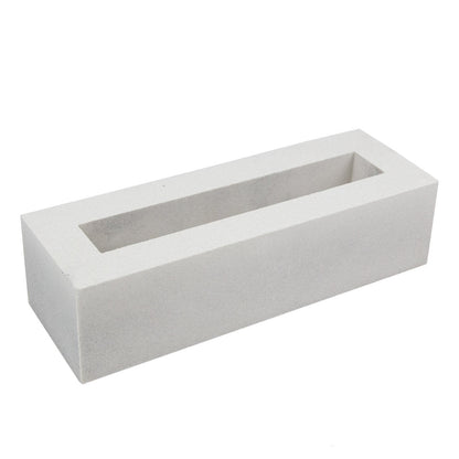 Elba, Extra Sample by New York Cement Tile: a white rectangular hollow screen block with sharp edges, shown angled.