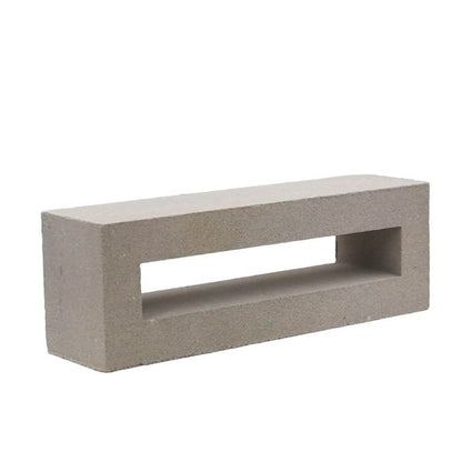 The Elb Sample by New York Cement Tile is a rectangular block with a large central hole, ideal as a decorative partition.
