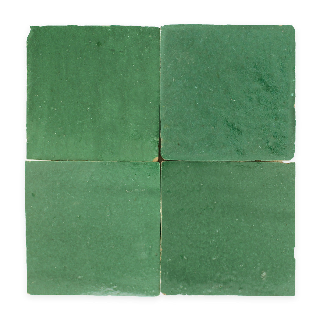 Four square, green tiles arranged in a 2x2 grid on a white background.