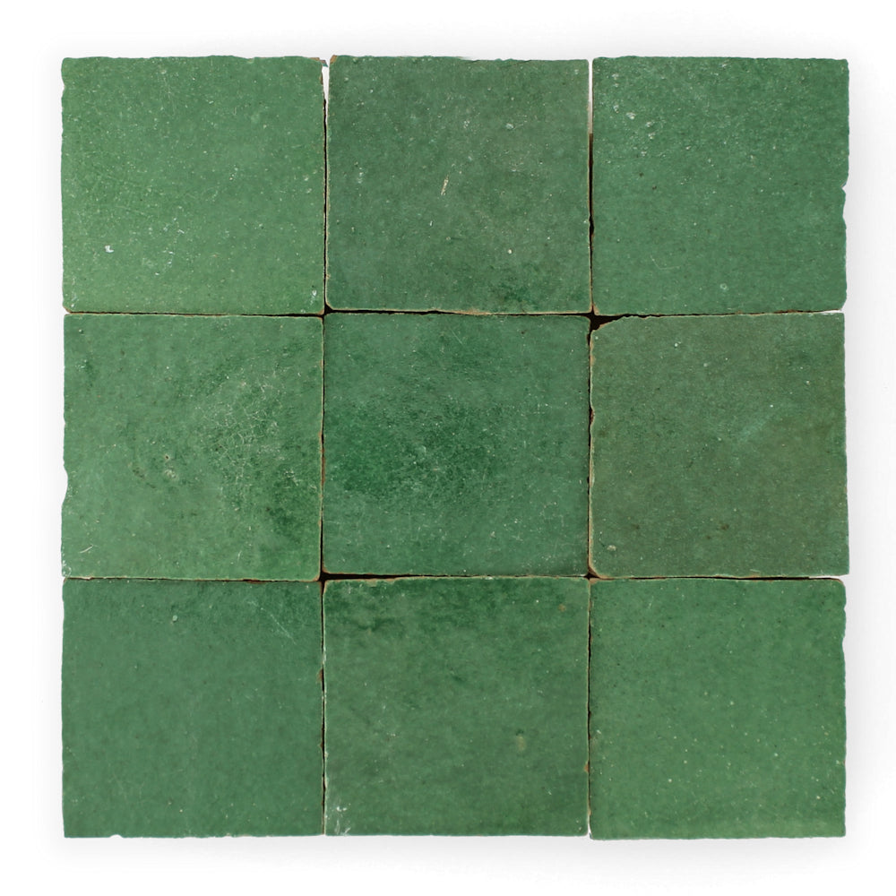 Nine Forest Green Zellige tiles by New York Cement Tile in a 3x3 grid, each with unique texture and color variations.