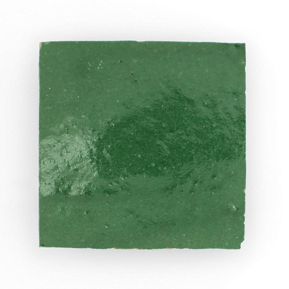 A glossy, square Forest Green tile by New York Cement Tile, handcrafted from natural clay. Sample shown on white.