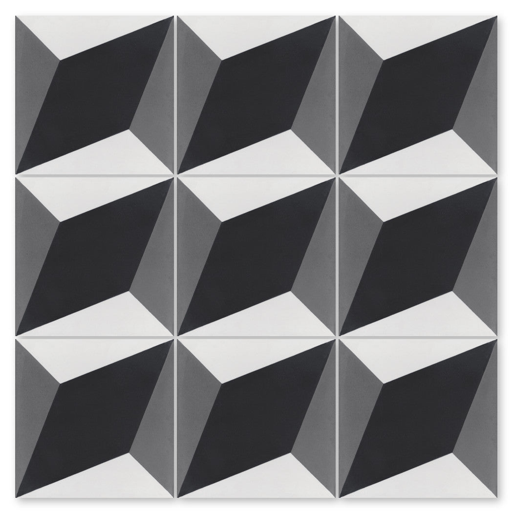 The N20-034 by New York Cement Tile features 9 handcrafted tiles with black, white, and gray 3D diamond geometric patterns.