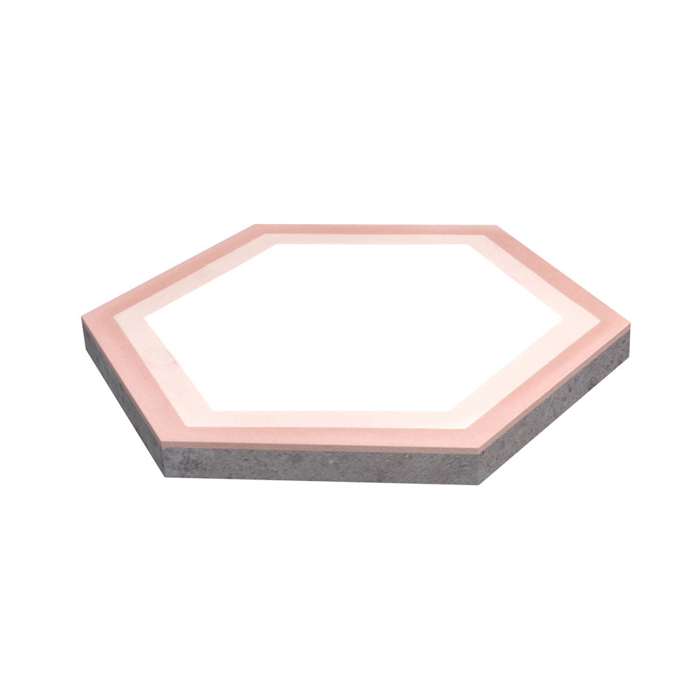 NH23-004 Sample by New York Cement Tile: a pink-bordered hexagonal tile with a white center on a white background.