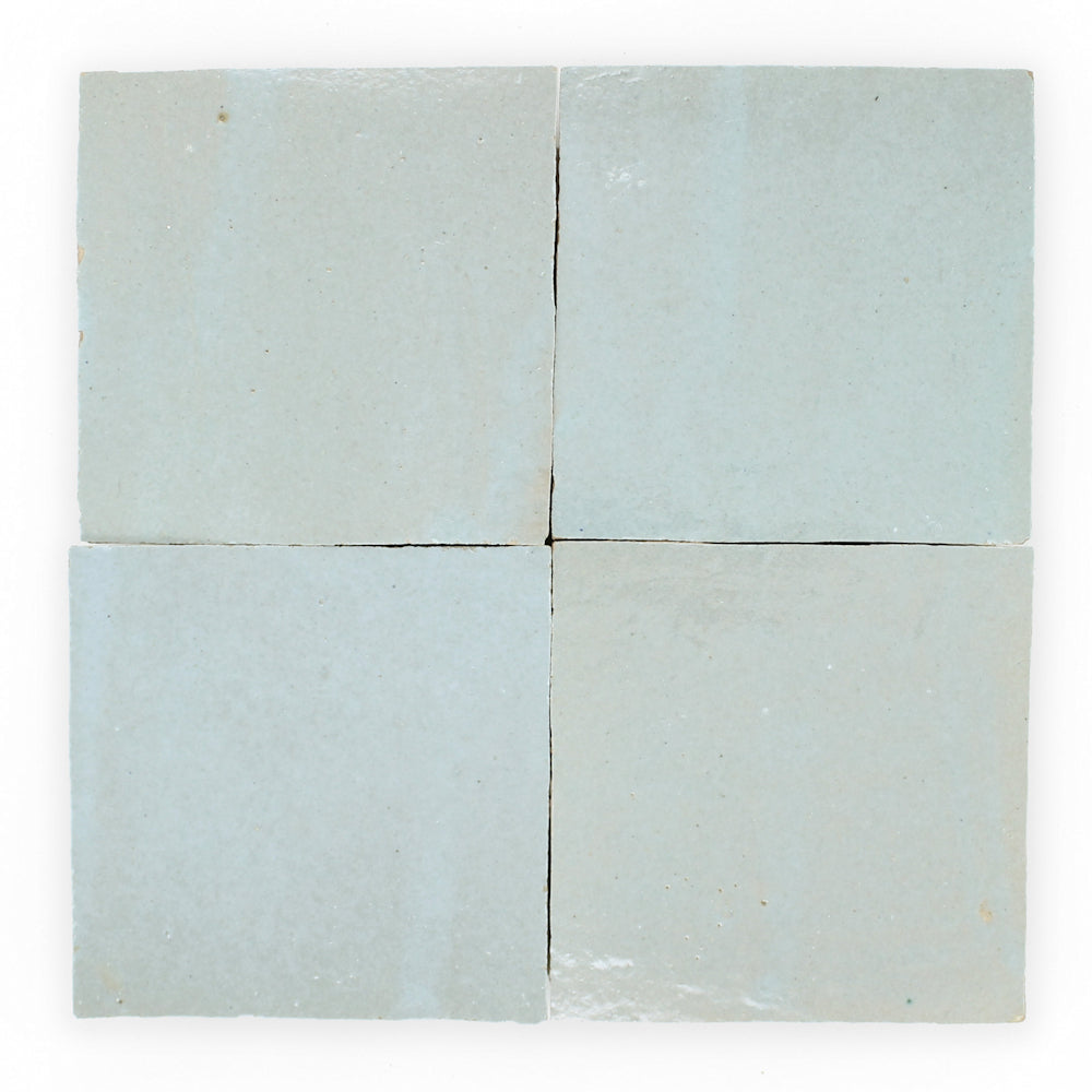 Four Arctic Blue tiles by New York Cement Tile, extra sample, arranged in a 2x2 grid on a white background.