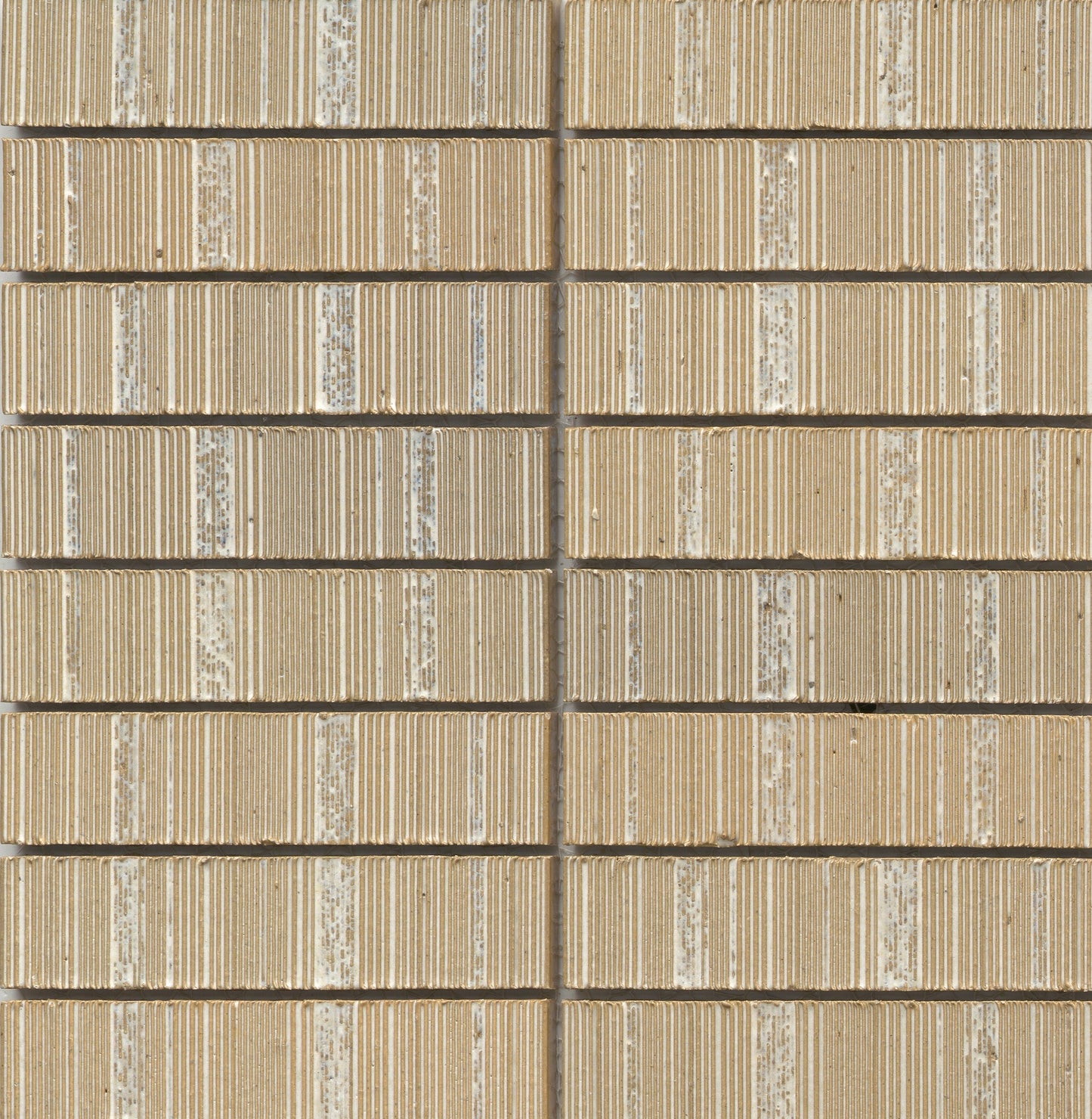 Close-up of Ivory - Newtro sample by New York Cement Tile, featuring a beige geometric wall with textured horizontal lines.