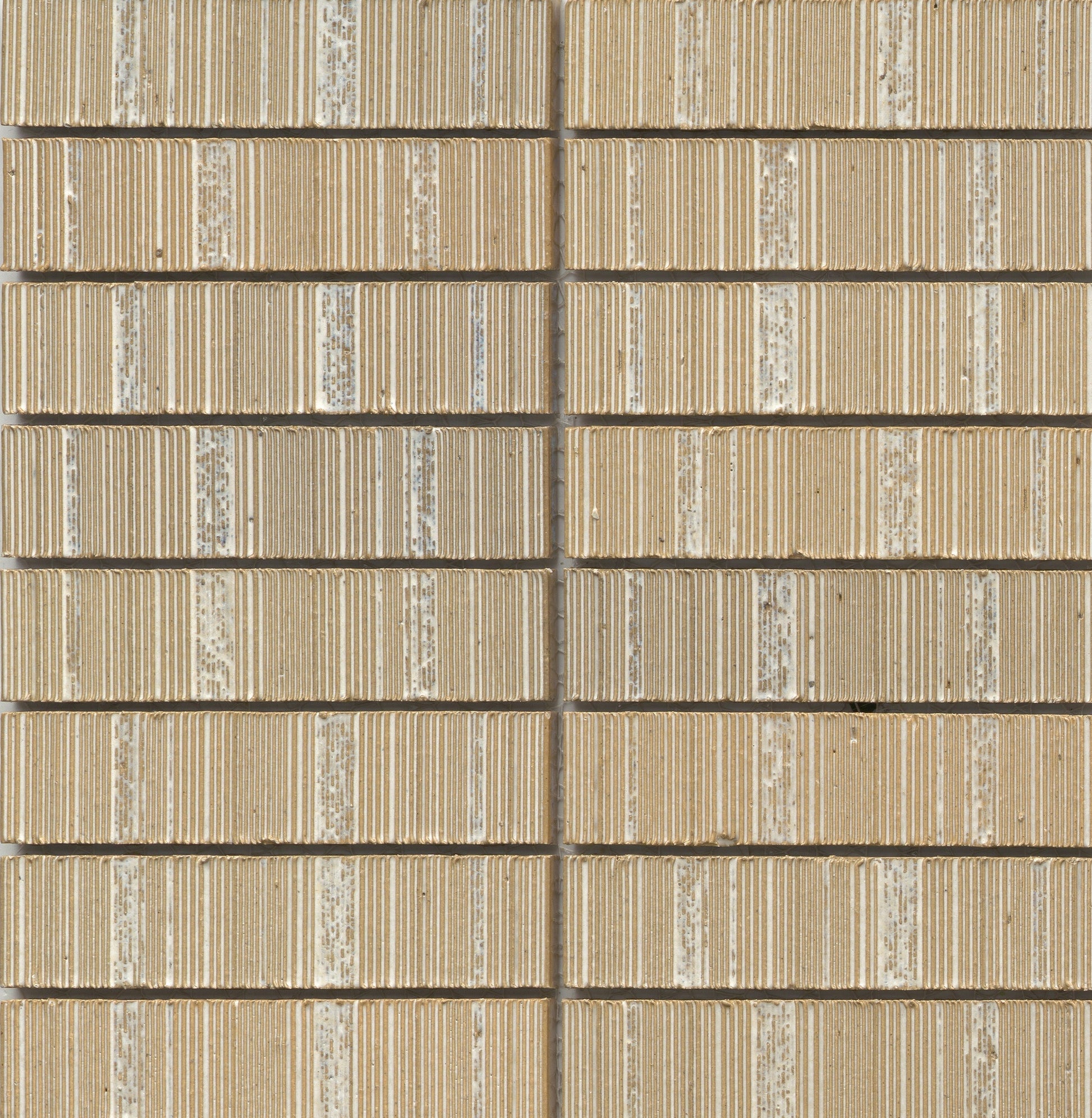 Close-up of Ivory - Newtro sample by New York Cement Tile, featuring a beige geometric wall with textured horizontal lines.