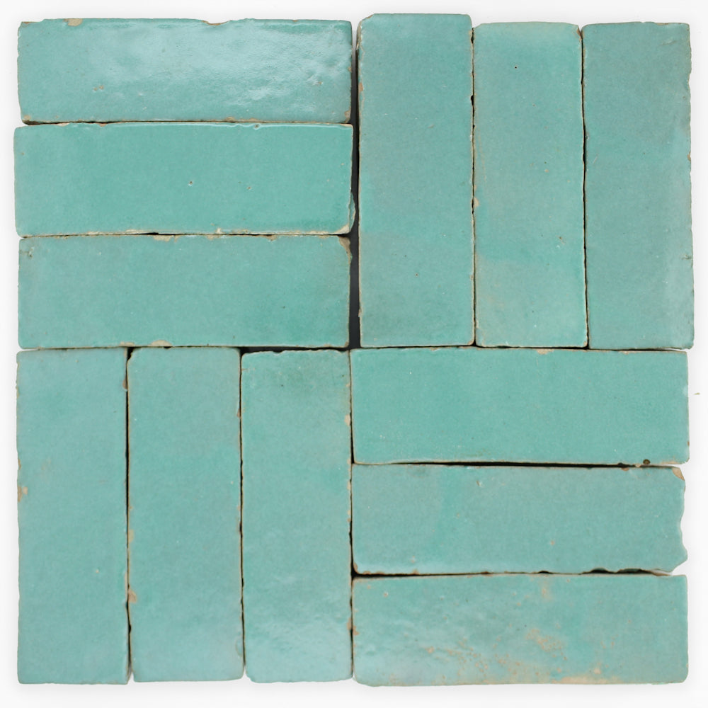 A square layout of Seafoam (2x6) Zellige tiles by New York Cement Tile, with gaps and handcrafted edges.